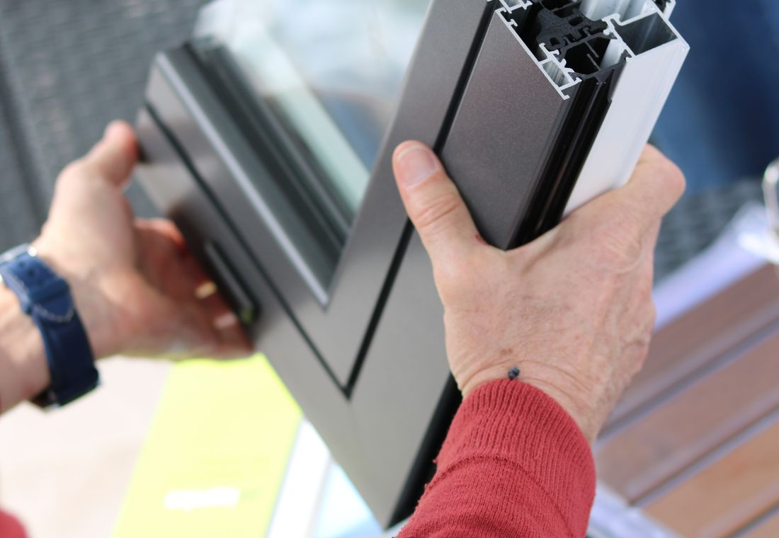 Craftsman fitting a custom aluminium window profile for a perfect fit